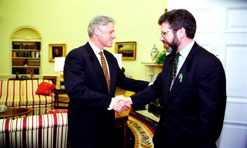 President Bill Clinton shakes hands with Gerry Adams