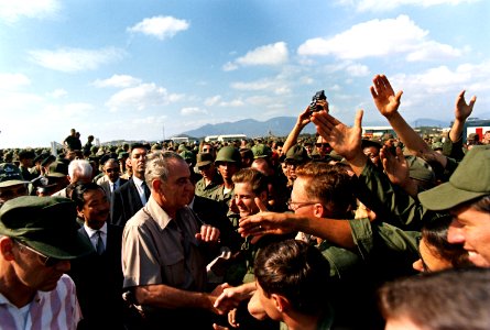 President Lyndon B. Johnson in Vietnam, Handshakes in a crowd of troops - NARA - 192517 - cropped, color corrected photo