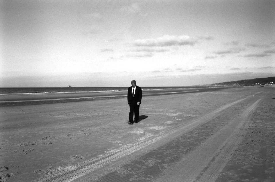 President Bill Clinton walks on Omaha Beach in Normandy, France