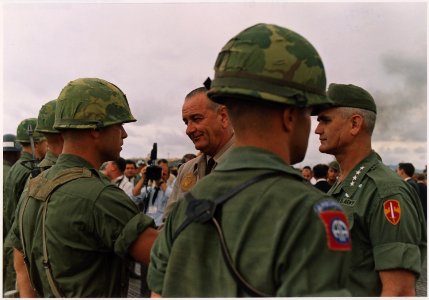 President Lyndon B. Johnson in Vietnam, With General William Westmoreland decorating a soldier - NARA - 192511 photo