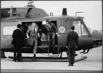 President Nixon and unidentified aide disembarking from a helicopter - NARA - 194573