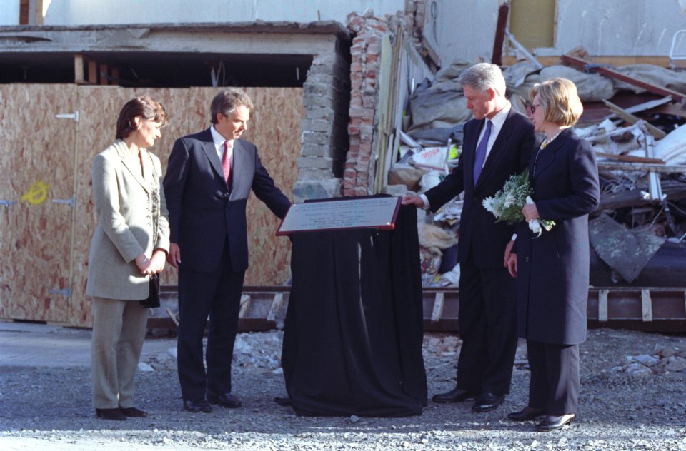 President Bill Clinton, First Lady Hillary Clinton, British Prime Minister Tony Blair and wife Cherie Blair unveil a plaque at the site of the Omagh bombing, in Omagh, Northern Ireland
