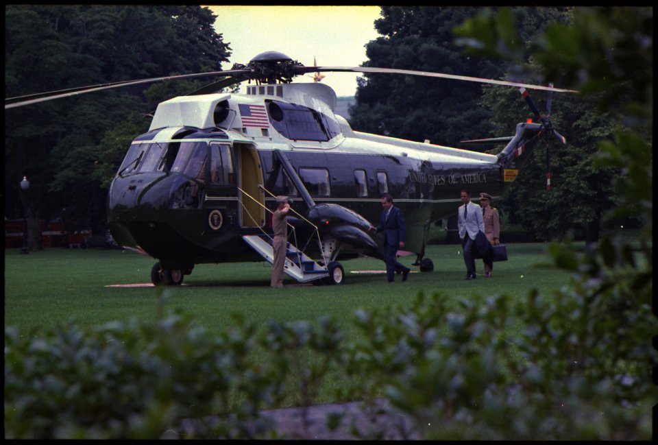 President Nixon, H.R. Haldeman, and military aide boarding Marine One - NARA - 194438