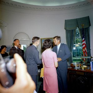 President John F. Kennedy greets the first group of Peace Corps Volunteers going to Tanganyika and Ghana, in the the Oval Office - KN-C18662 photo