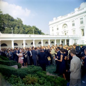 President John F. Kennedy greets the first group of Peace Corps Volunteers going to Tanganyika and Ghana, in the White House Rose Garden - KN-C18661