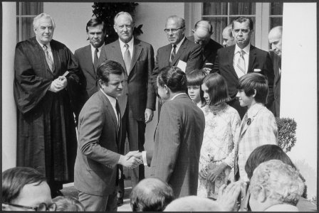 President Nixon shaking hands with Senator Ted Kennedy at the White House swearing-in ceremony for Secretary Elliott... - NARA - 194681