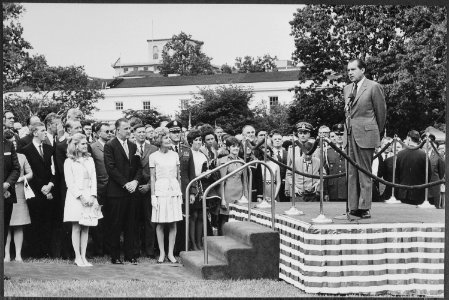 President Nixon speaks to assembled White House staff on the south lawn after return from Midway Island conference... - NARA - 194635 photo