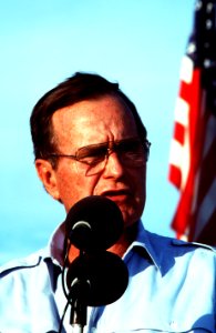 President George H. W. Bush speaks to the Marines and sailors during a stop at a desert encampment