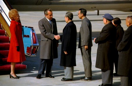 President Richard Nixon and Premier Chou En-Lai Shake Hands at the Nixons' Arrival in Peking, China photo