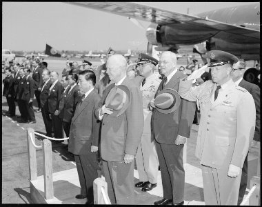 President of South Vietnam Ngo Dinh Diem, left, is welcomed in ceremonies at Washington National Airport. With him is... - NARA - 542190