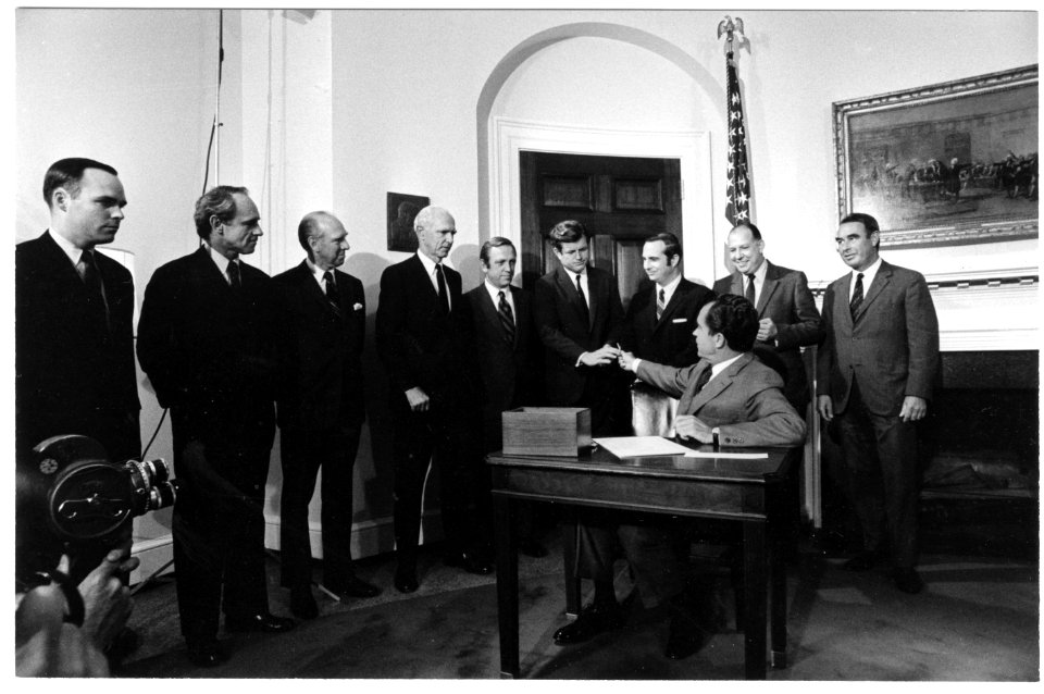 President Richard Nixon Handing a Pen to Senator Edward Kennedy after Signing the Older American Act Amendments of 1969