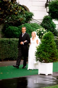 President Richard Nixon escorts daughter Tricia to her wedding photo