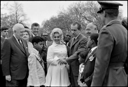 President Richard Nixon Receiving a U.S. Savings Bond button from Eva Gabor