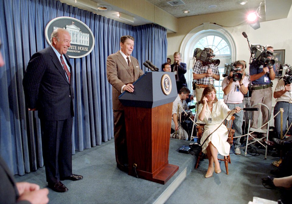 President Ronald Reagan and George Shultz giving a statement on the US-USSR diplomatic talks