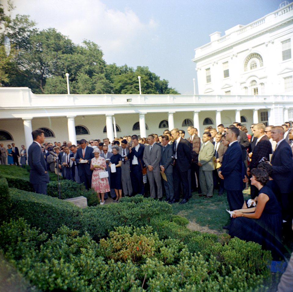 President John F. Kennedy greets the first group of Peace Corps Volunteers going to Tanganyika and Ghana, in the White House Rose Garden - KN-C18661-B photo