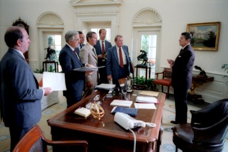 President Ronald Reagan and his White House staff discuss the assassination of Egyptian President Anwar Sadat