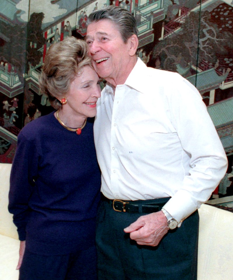 President Ronald Reagan and Nancy Reagan hugging during their 36th wedding anniversary in the White House residence (cropped)