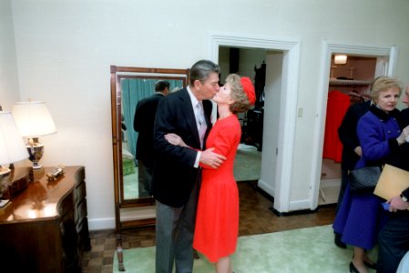 President Ronald Reagan and Nancy Reagan kissing at Blair House before the Inaugural Ceremony