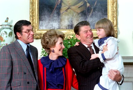 President Ronald Reagan and Nancy Reagan and Nancy Reagan meeting with Jerry Lewis and the Muscular Dystrophy poster child Christi Bartlett in the Oval Office