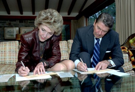 President Ronald Reagan and Nancy Reagan signing their Absentee Ballots at Camp David