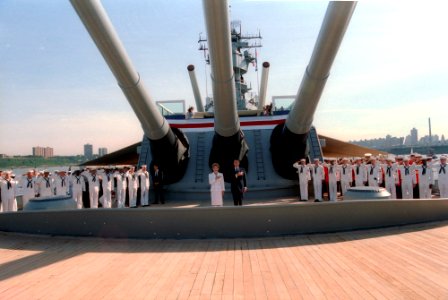 President Ronald Reagan and Nancy Reagan standing under the guns of the battleship U.S.S. Iowa during the Statue of Liberty Centennial weekend celebrations photo