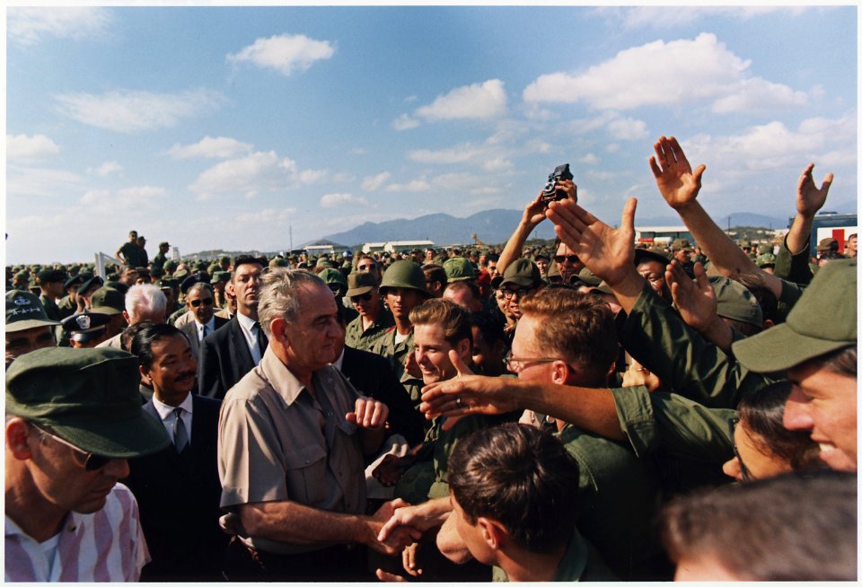 President Lyndon B. Johnson in Vietnam, Handshakes in a crowd of troops - NARA - 192517