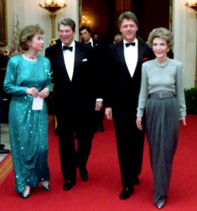President Ronald Reagan and Nancy Reagan with Bill Clinton and Hillary Clinton walking in the Cross Hall (cropped)
