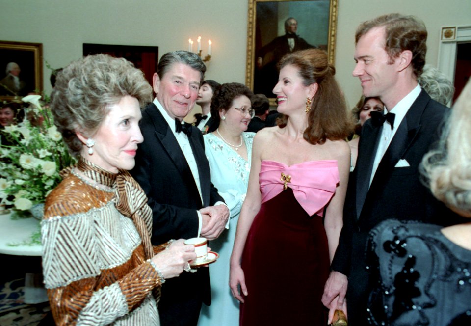 President Ronald Reagan and Nancy Reagan talking to Ariana Huffington and Mike Huffington