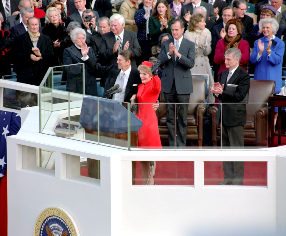 President Ronald Reagan and Nancy Reagan waving after swearing in ceremony at west front of United States Capitol