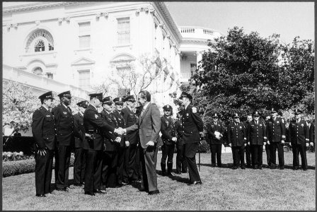 President Nixon meeting District of Columbia Metropolitan Police Department officers to congratulate them on their help... - NARA - 194765