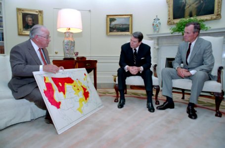 President Ronald Reagan and Vice President George H. W. Bush in the Oval Office discuss the status of the drought situation with Richard Lyng photo