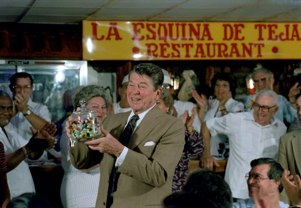 President Ronald Reagan holding a jelly bean jar