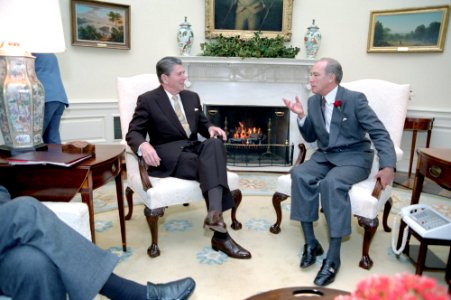 President Ronald Reagan meeting with Prime Minister Pierre Trudeau of Canada during working visit in Oval Office photo