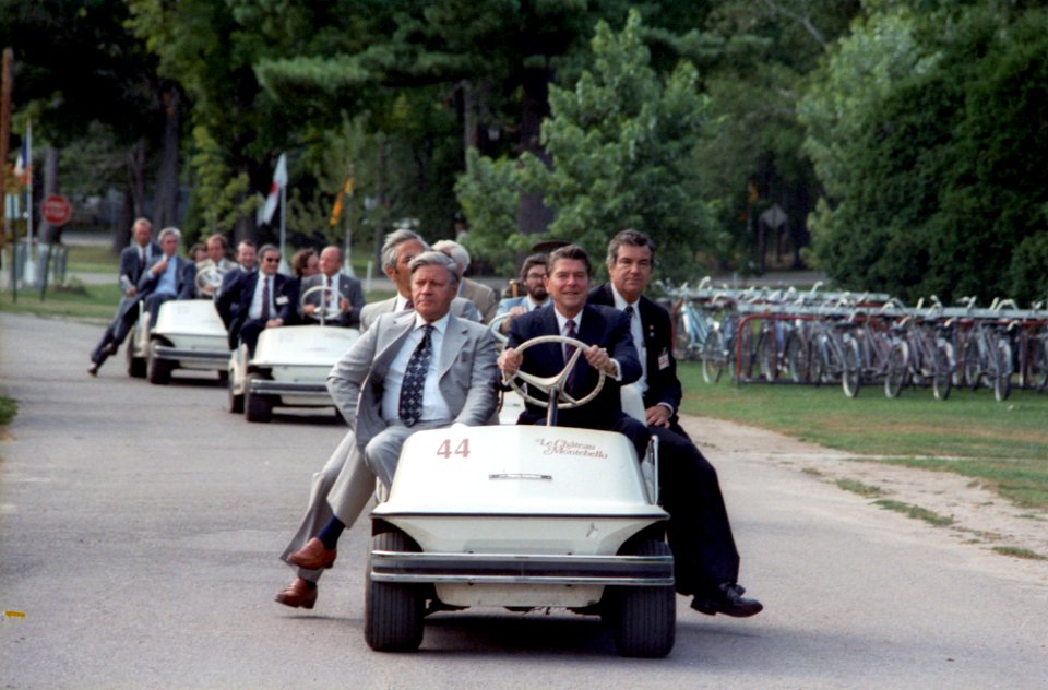 President Ronald Reagan and Chancellor Helmut Schmidt of Federal Republic of Germany riding a golf cart