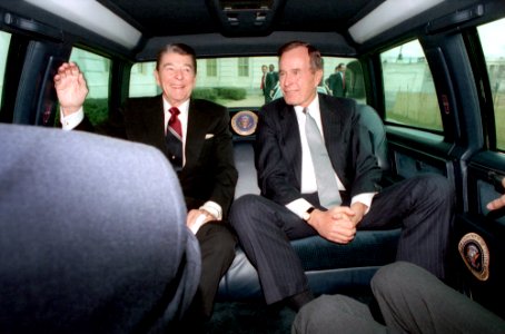 President Ronald Reagan and George H. W. Bush traveling via limousine to the United States Capitol