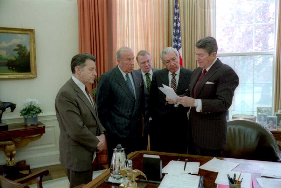 President Ronald Reagan meets with aides on Iran-Contra