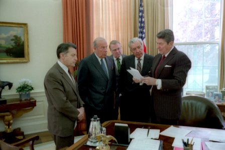 President Ronald Reagan meets with aides on Iran-Contra