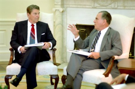 President Ronald Reagan meeting with Charles Wick in the Oval Office