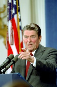 President Ronald Reagan pointing from podium during 13th Press Conference in the East Room