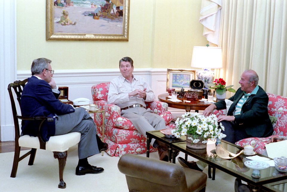 President Ronald Reagan meeting with George Shultz and Frank Carlucci
