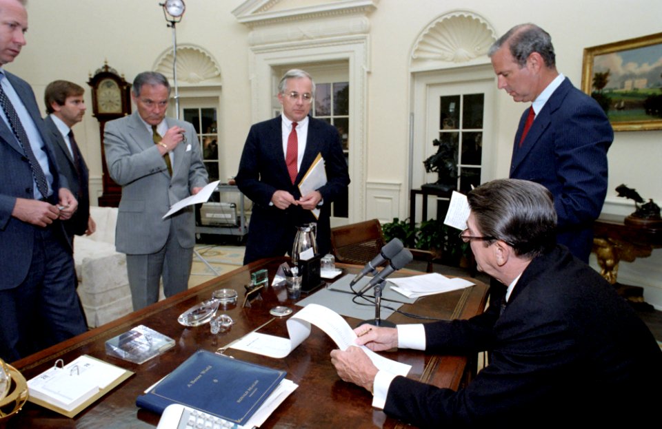 President Ronald Reagan meeting with Senior Staff to discuss the Senate vote on the proposed sale of the air defense enhancement package AWACS to Saudi Arabia