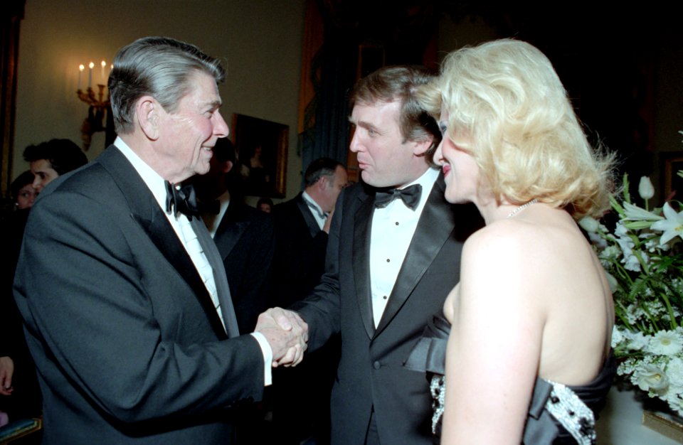 President Ronald Reagan shaking hands with Donald Trump and Ivana Trump