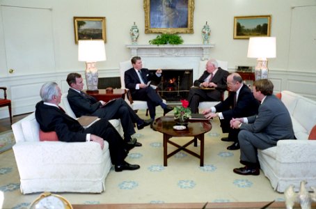 President Ronald Reagan meeting with William Casey, George H. W. Bush, John Poindexter, Don Fortier, and Don Regan in the Oval Office photo