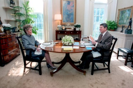 President Ronald Reagan and Nancy Reagan having lunch in honor of their 35th Wedding Anniversary in the Oval Office Study