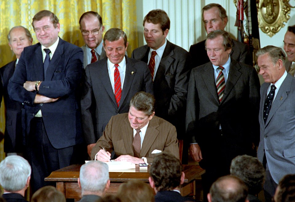 President Ronald Reagan participating in a Signing Ceremony for HR 6211 the Surface Transportation Assistance Act in the East Room
