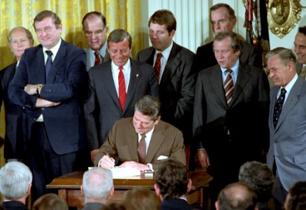 President Ronald Reagan participating in a Signing Ceremony for HR 6211 the Surface Transportation Assistance Act in the East Room