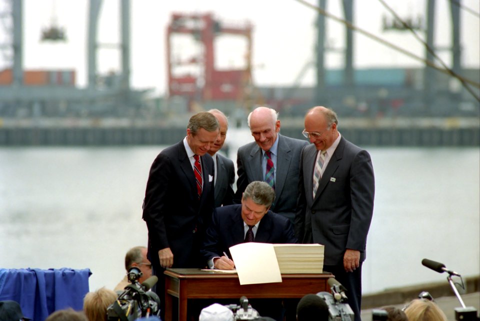 President Ronald Reagan signing the Omnibus Trade and Competitiveness Act