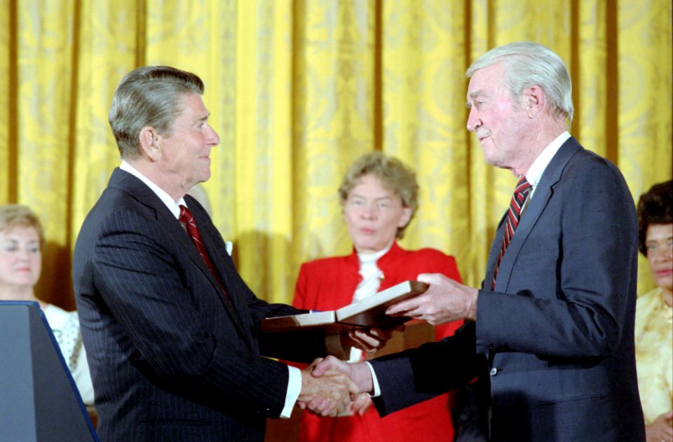 President Ronald Reagan Presenting Medal of Freedom Award to Jimmy Stewart in East Room