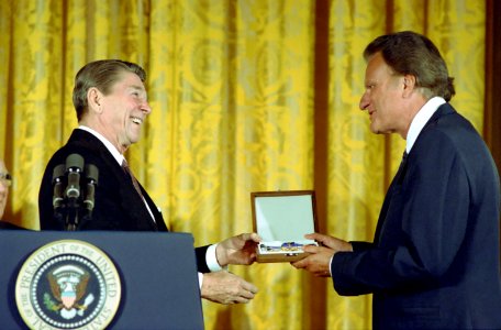 President Ronald Reagan presenting the Presidential Medal of Freedom to Billy Graham in the East Room