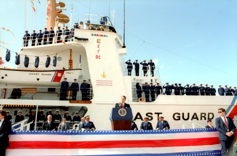 President Ronald Reagan speaking at a podium in Miami Beach, Florida